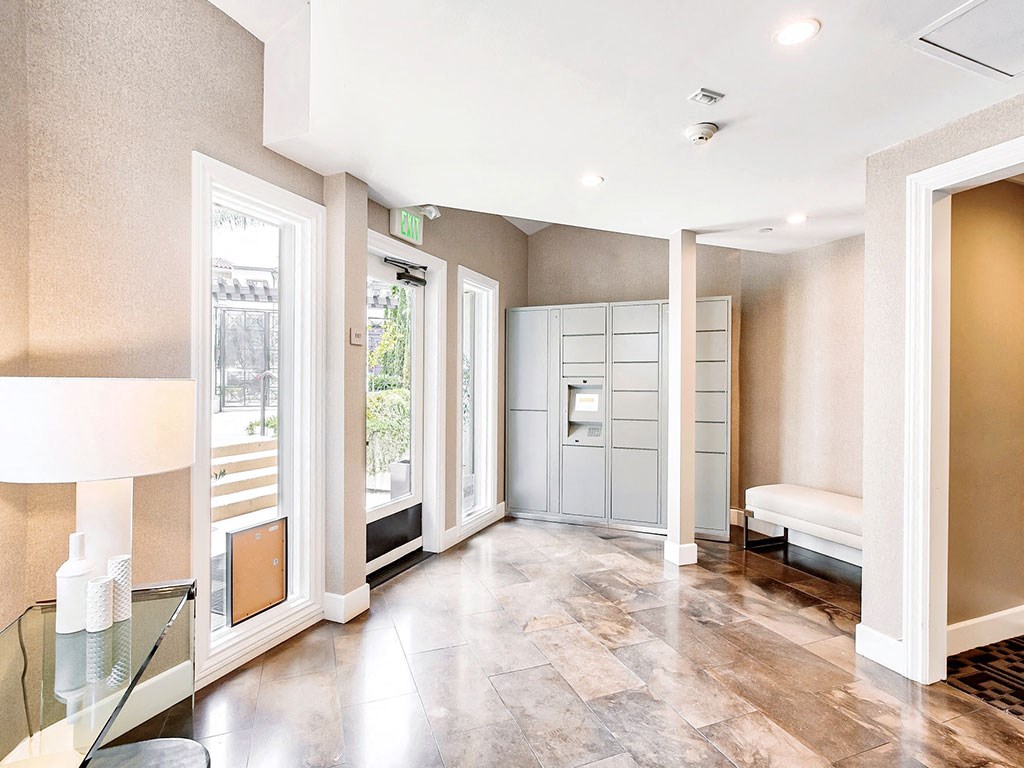 a living room with a couch and a glass door