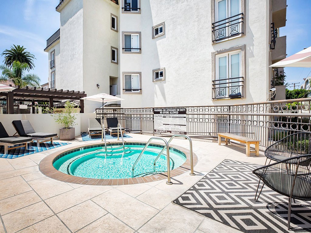 our apartments have a resort style pool and lounge chairs