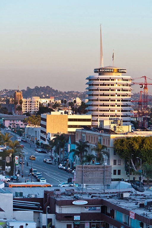 a view of a city with a tall building