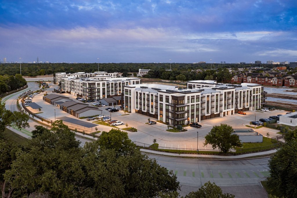 an aerial view of a city with many buildings and trees