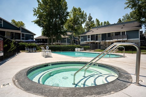 A round above ground pool with a slide.