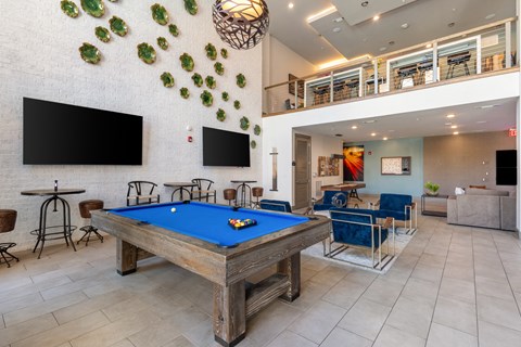 play a game of pool in our game room at our apartments