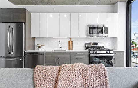 a view of the seats of an empty stadium with the textured walls and chairs