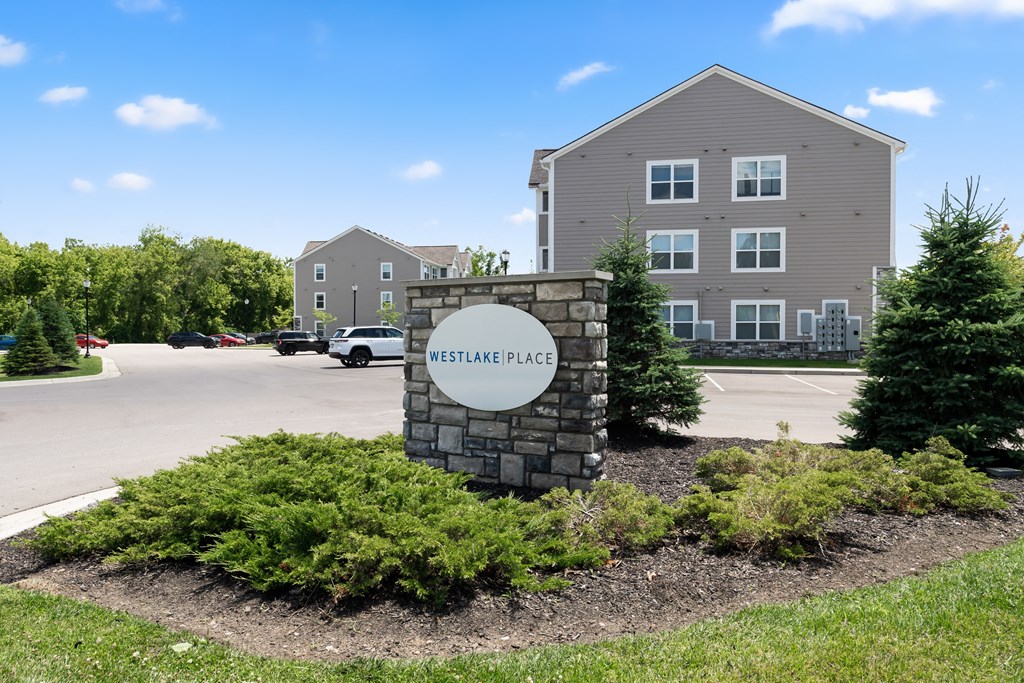A sign that says Westlake Place in front of a building.