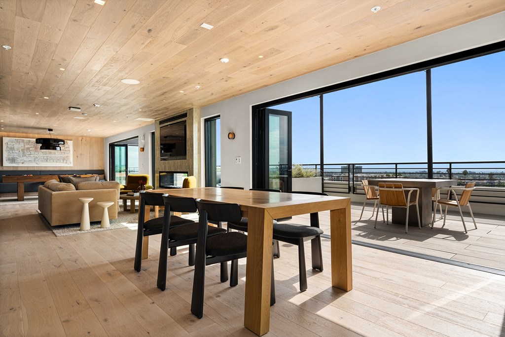 A modern interior with a wooden table and chairs.