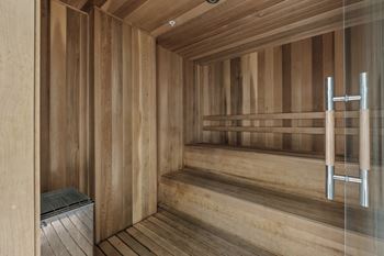 A sauna with wooden walls and benches.