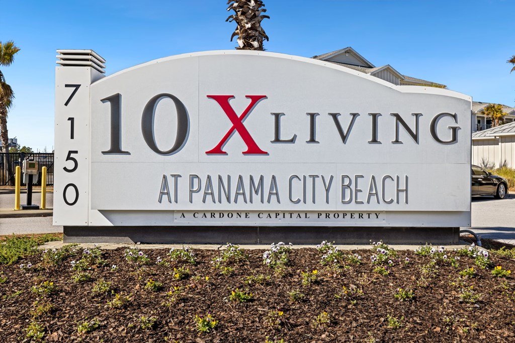 A sign for 10 X Living at Panama City Beach.