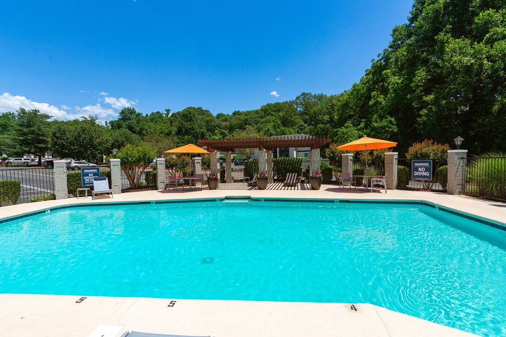 the pool at the whispering winds apartments in pearland, tx