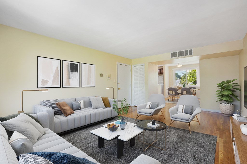 a living room with couches and chairs and a coffee table