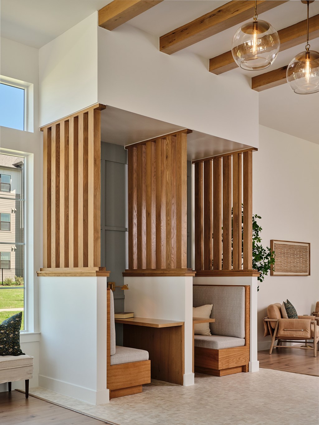 A room with a wooden partition and a couch.