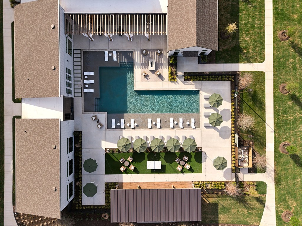 A modern house with a pool and a garden.