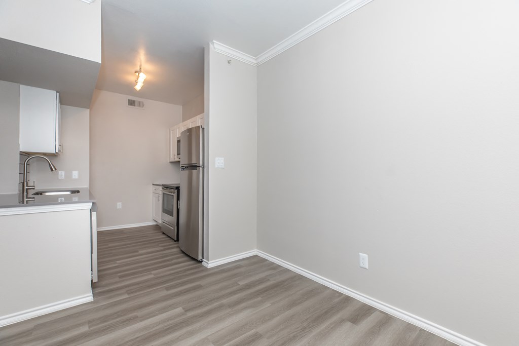 a kitchen and living room in a 555 waverly unit