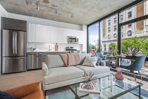 a living room with a couch and a glass table