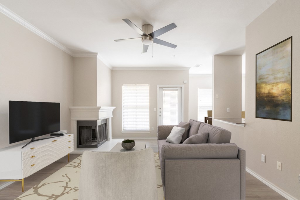 a living room with a couch and a tv