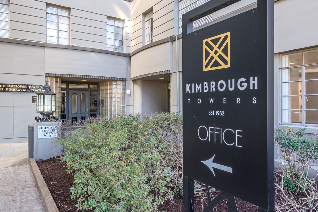 a sign in front of a building that reads