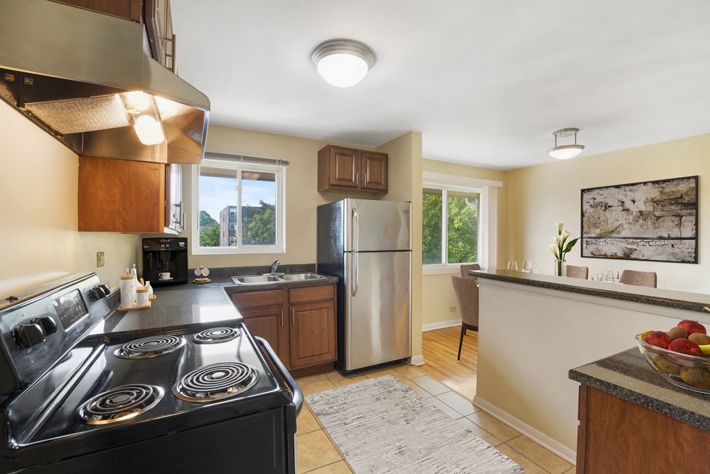 a kitchen with a stove and a refrigerator