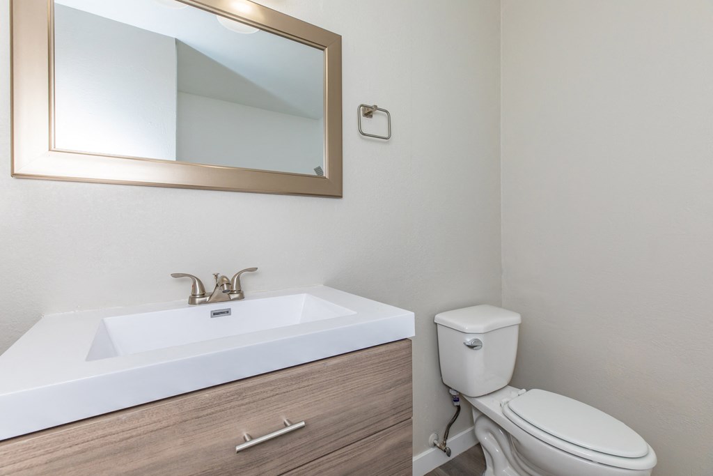 a bathroom with a sink and toilet in a 555 waverly unit