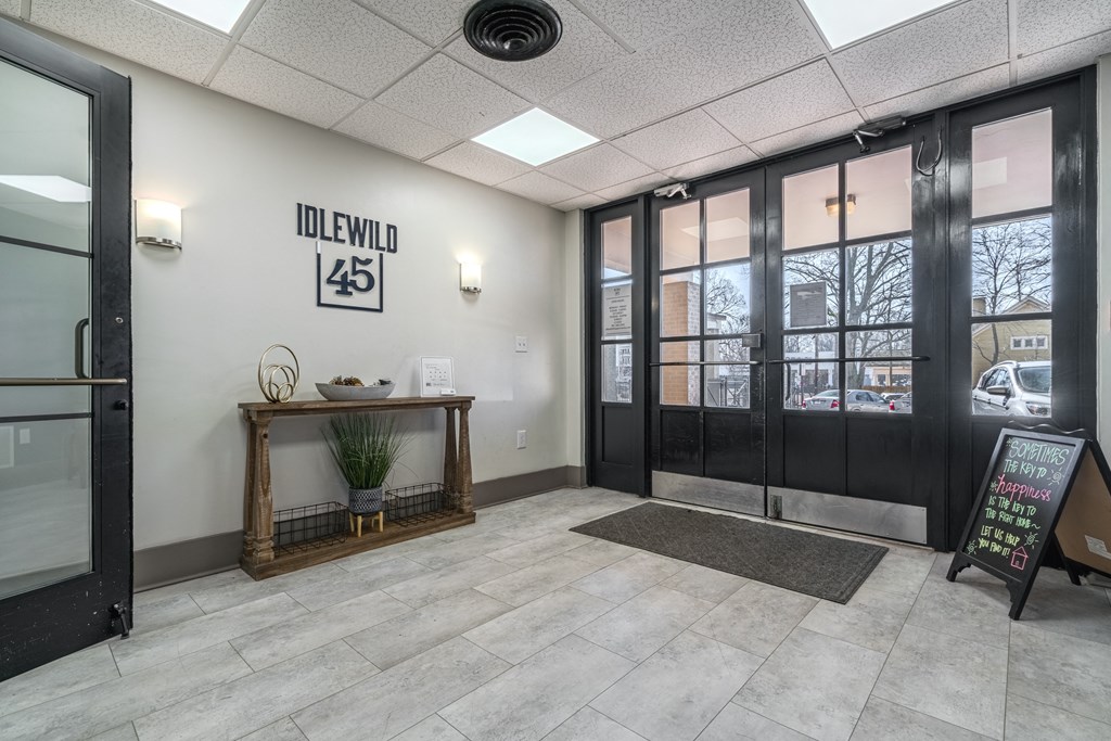 the entrance to the lobby of a building with glass doors