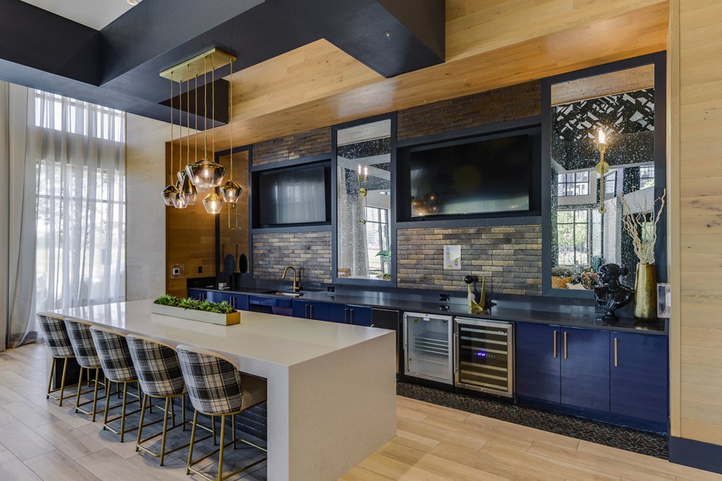 a kitchen with blue cabinets and a white counter top