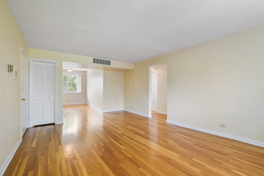 Spacious living room with hardwood flooring