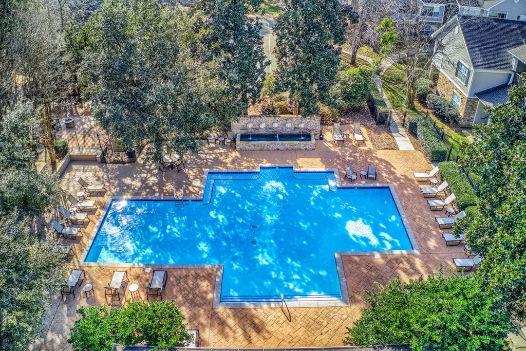 a backyard with an aerial view of a swimming pool
