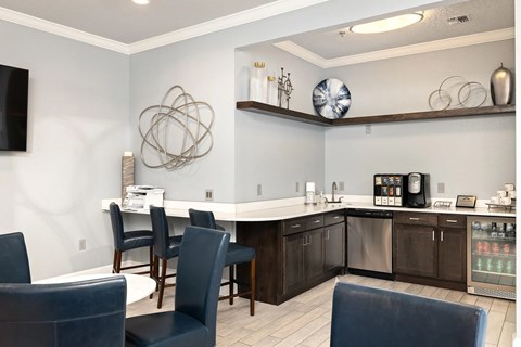 A modern kitchen with dark wood cabinets and a white island.