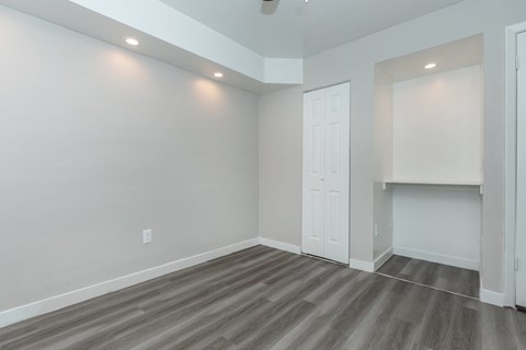 a living room with grey walls and a white door