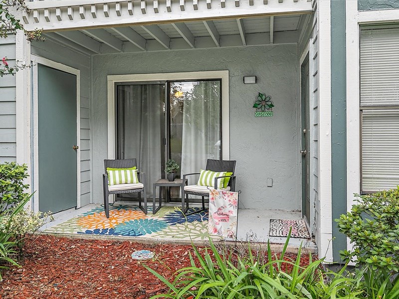 model patio with two chairs and a small table