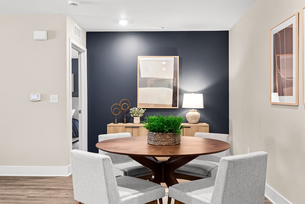 a dining room with a table and chairs
