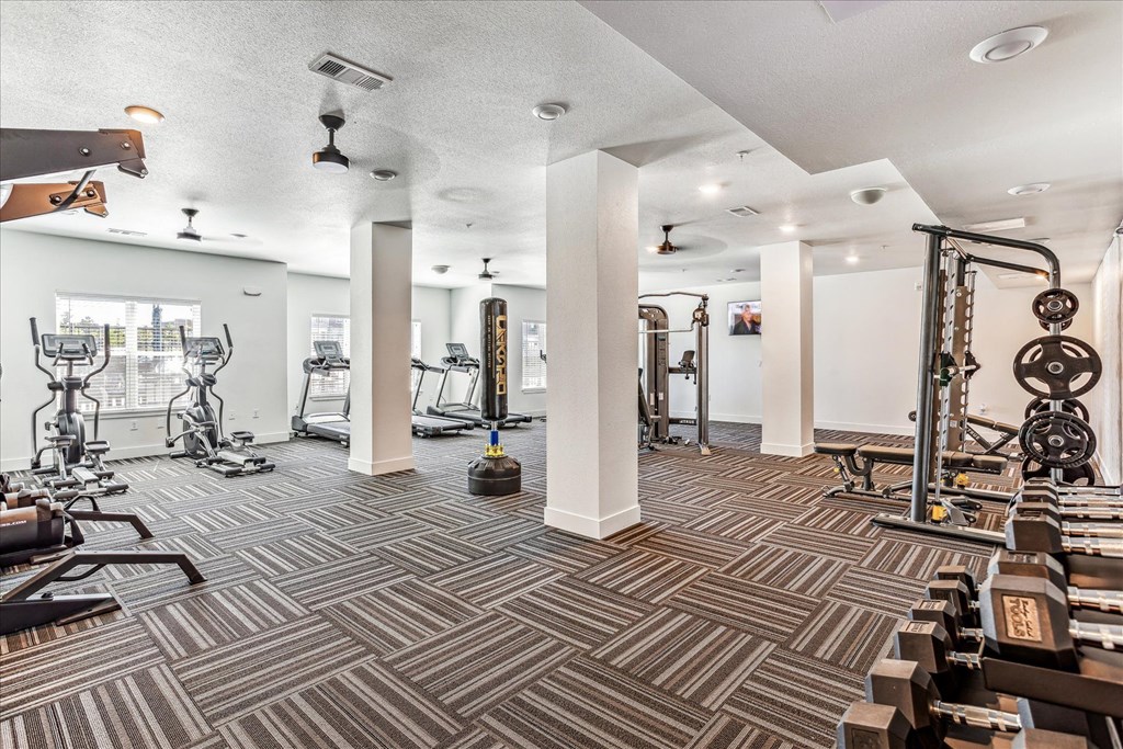 the gym at the district flats apartments in lenexa