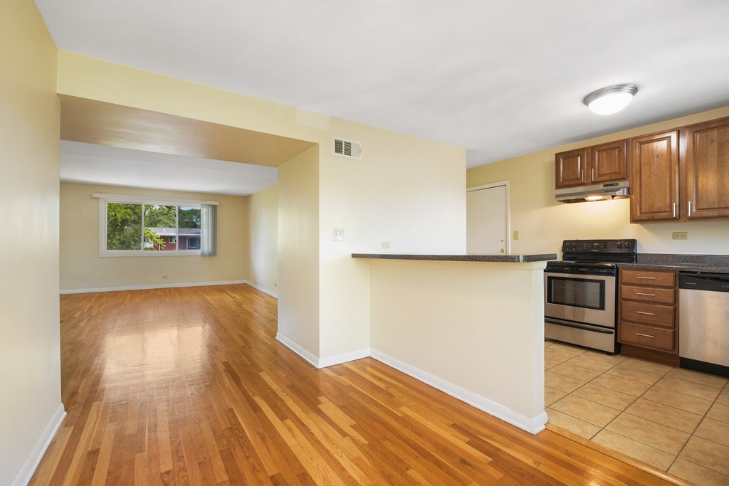 Spacious living room with hardwood flooring