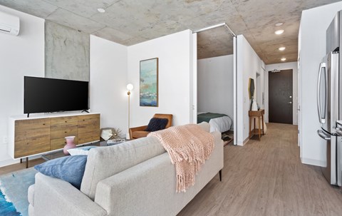 a living room with a couch and a tv