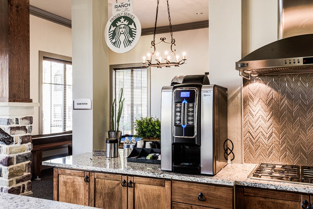 a kitchen with a coffee machine and a counter top