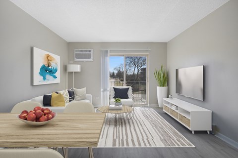 a living room with a table and a couch and a television