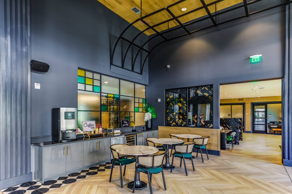 the lobby of a restaurant with tables and chairs