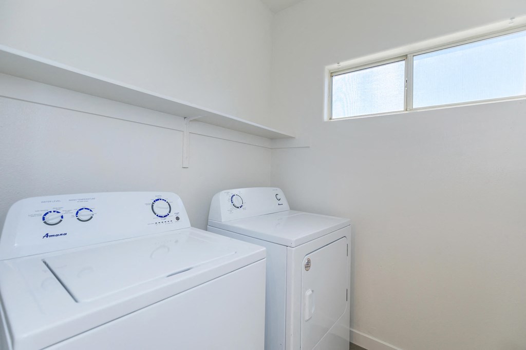 a laundry room with a washer and dryer