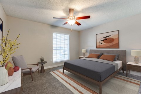 a bedroom with a bed and a ceiling fan