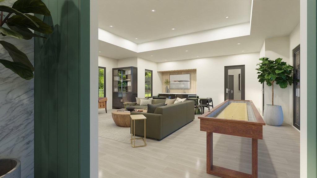A billiard table is in the middle of a living room.