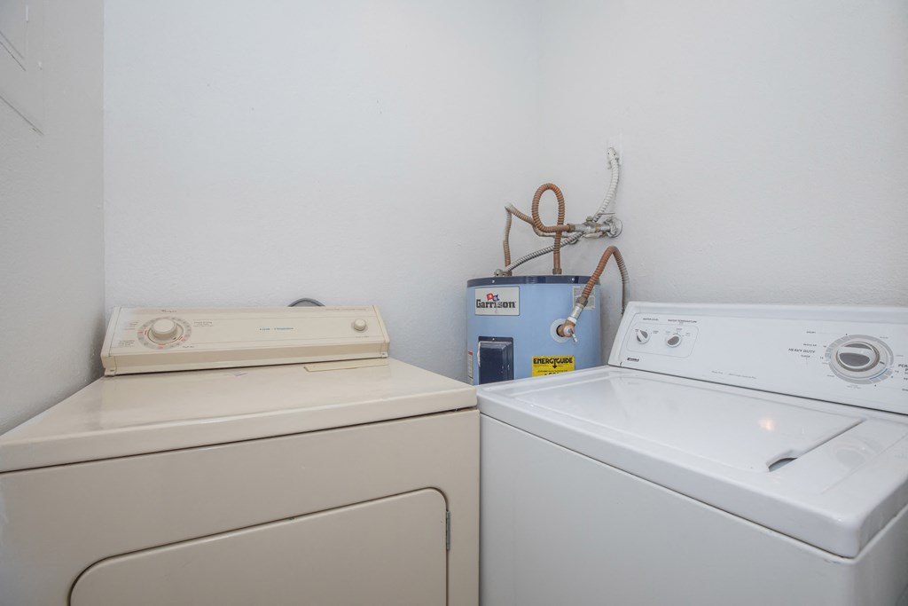 a laundry room with a washer and dryer