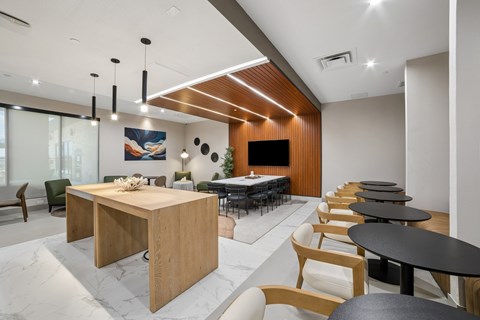 A conference room with a long table and chairs.