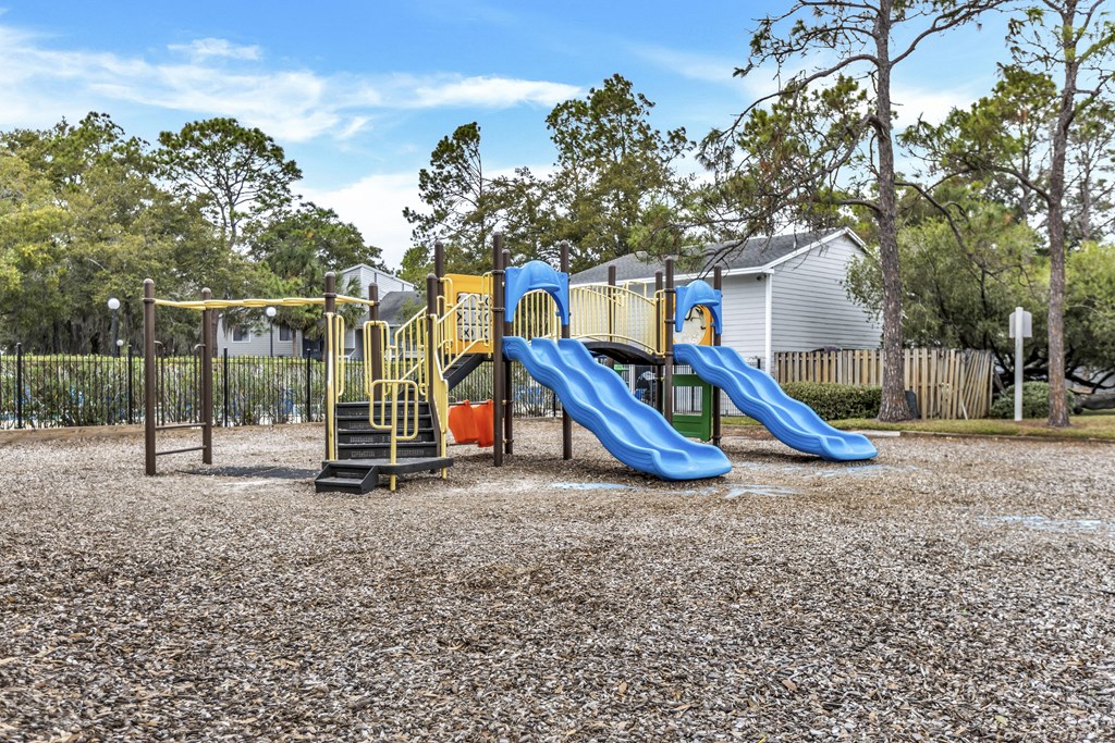 a playground with slides at a park