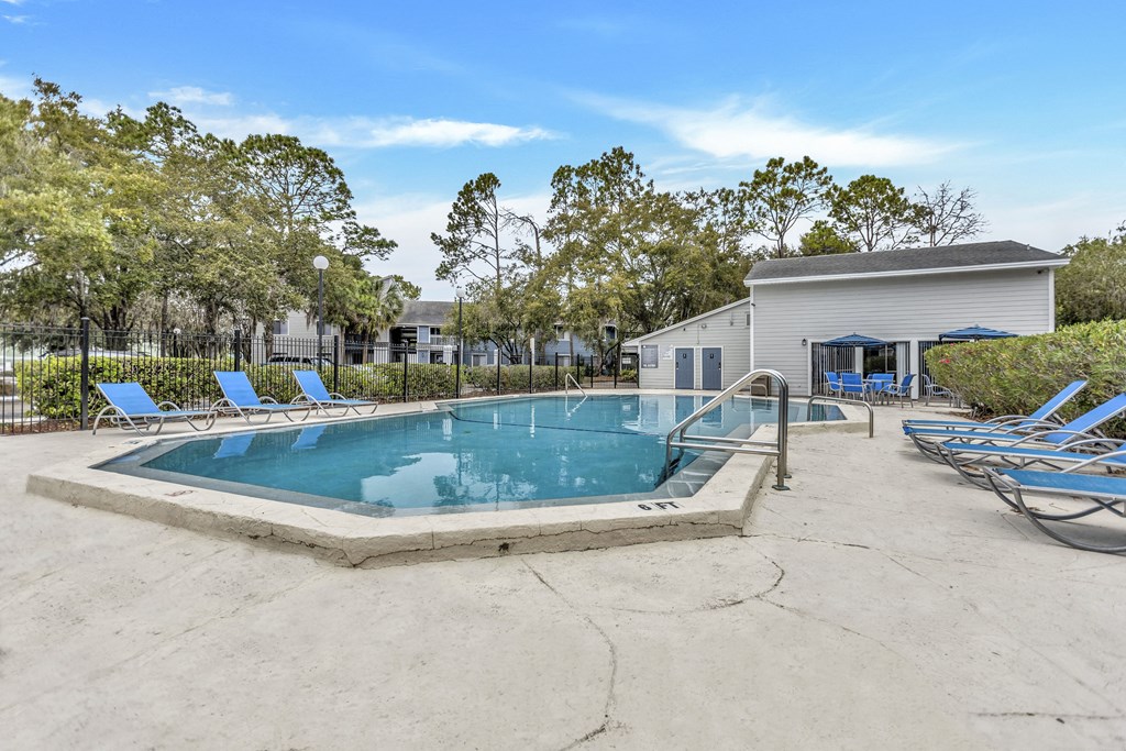 our resort style swimming pool is next to our clubhouse and has lounge chairs around it