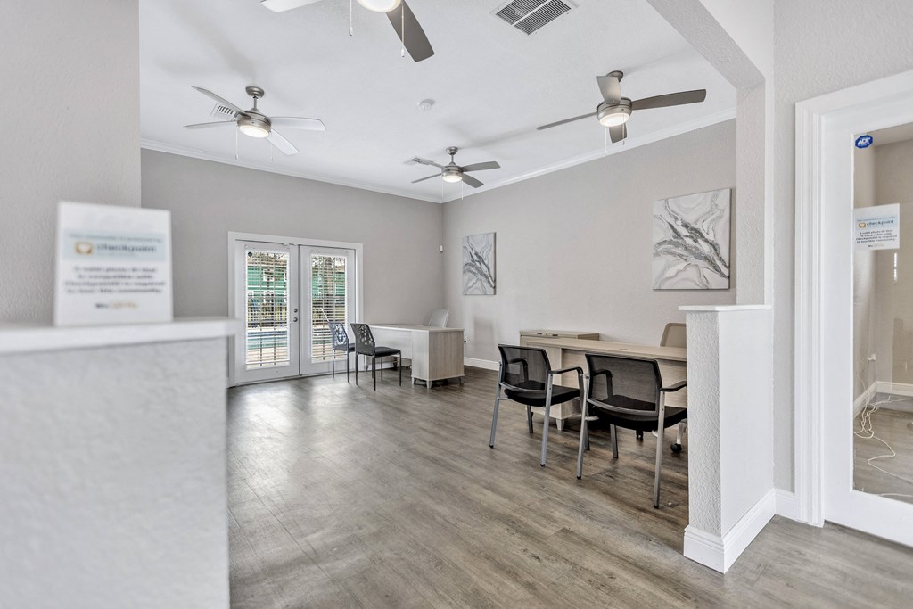 an open living room with a dining room table and chairs