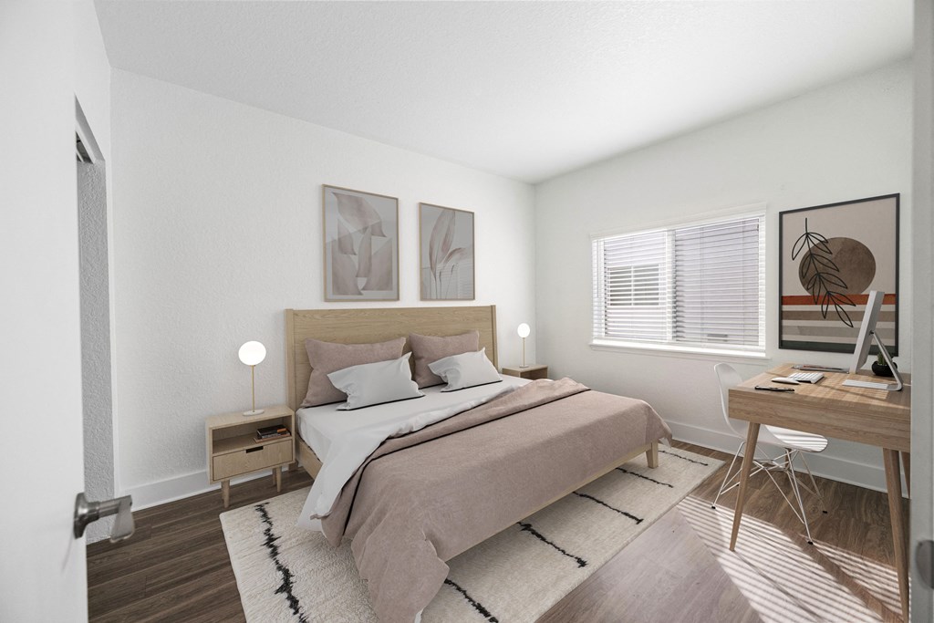 an image of a bedroom with a bed and a desk