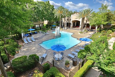pool side with umbrella tables