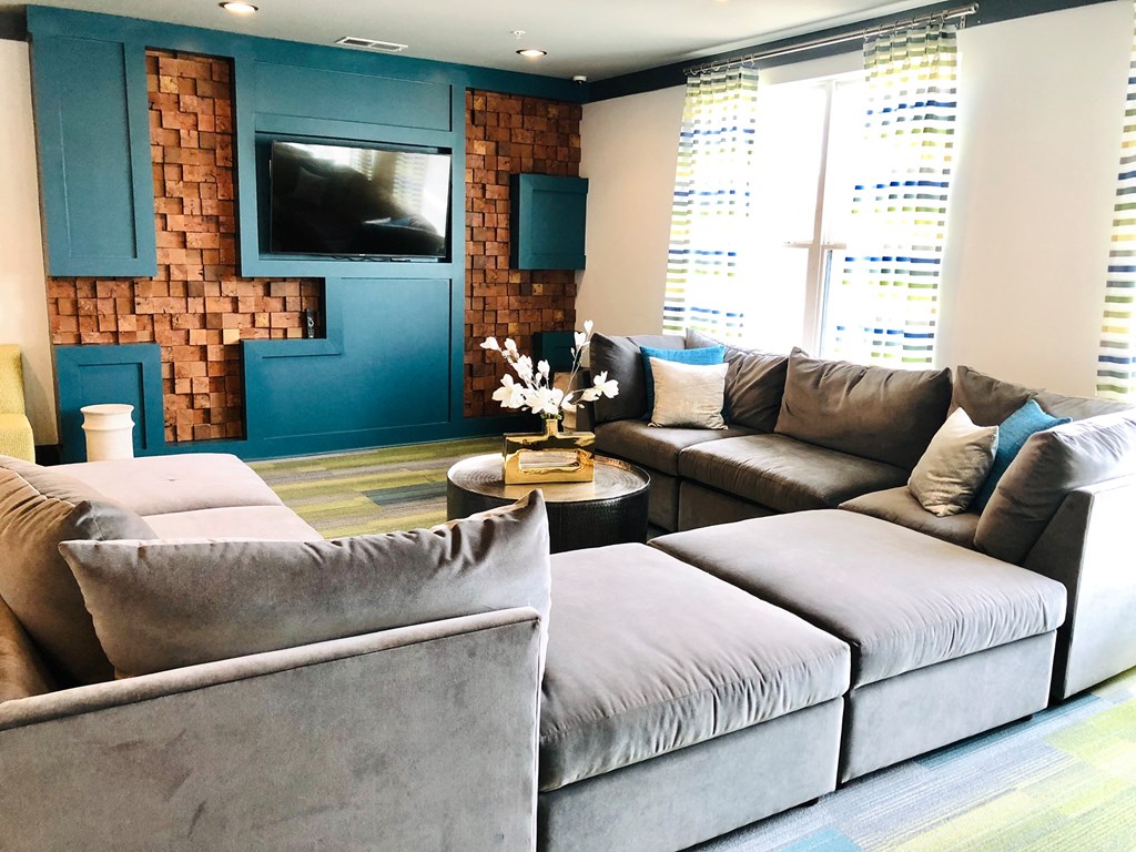 a living room with a couch and a tv