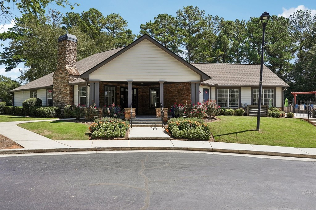 A house with a brick chimney and a porch.