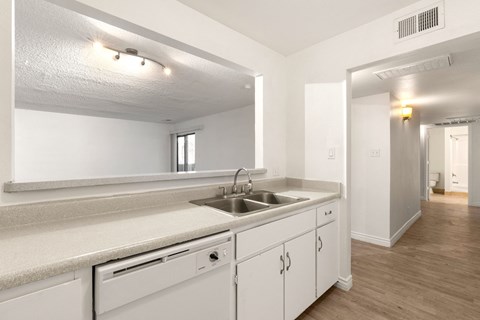 the preserve at ballantyne commons apartment kitchen with sink and white cabinets