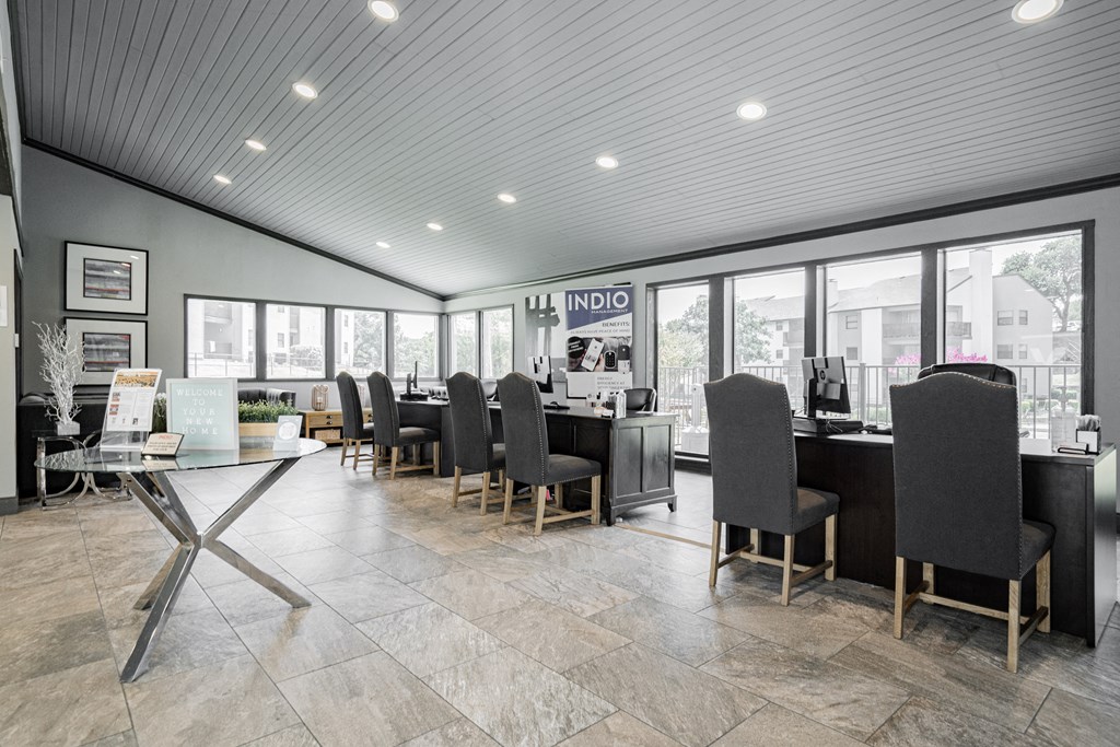 the lobby of a restaurant with tables and chairs