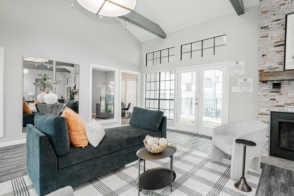 an open living room with a couch and a fireplace